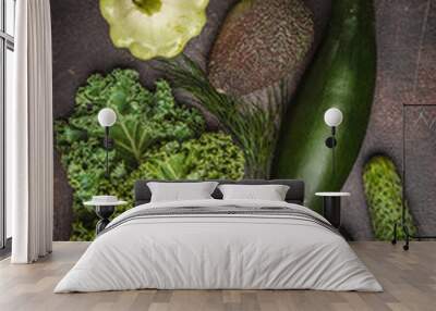 Assortment of green vegetables on a dark background, top view. Fruits and vegetables containing chlorophyll. Wall mural