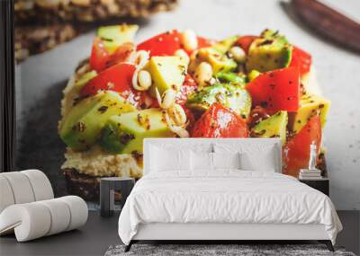 Avocado, hummus and tomato toast with seedlings. Healthy vegan food concept. Wall mural