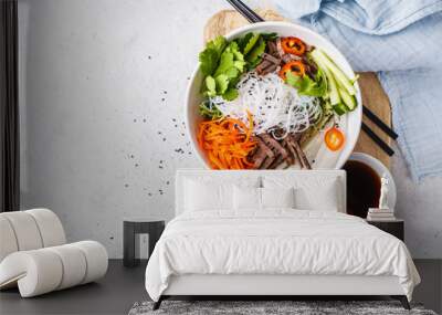 Bun cha salad bowl. Vietnamese rice noodle with beef and chilli vegetables salad in white bowl, copy space. Wall mural