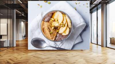 Chocolate chia pudding with banana, pistachio and maple syrup. Wall mural