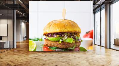 Cooking vegan burger with avocado, tomato and peanut sauce, white background with ingredients. Wall mural