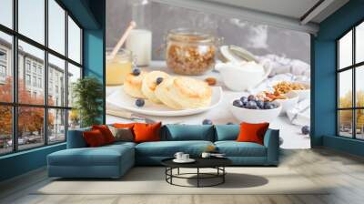 curd cheese cakes and granola with honey, yogurt, sour cream and milk Wall mural