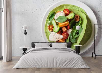 Open vegan tortilla wrap with broccoli, tofu and tomatoes. Vegetarian recipe, comfort food, plant-based concept. Wall mural