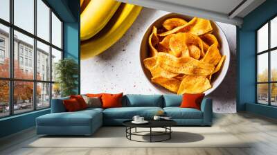 Spicy banana chips on gray background. Indian food concept. Wall mural