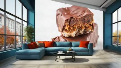 Vegan cocoa dates chocolate raw bars on white background. Wall mural