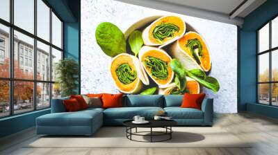 Vegan tortilla wraps with sweet potato and spinach, gray background, top view. Healthy vegetarian food concept. Wall mural