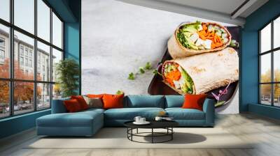 Vegan tortilla wraps with tofu, cucumber, carrots and avocado, copy space. Wall mural