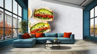 Vegetable sandwich in paper wrap. Vegan healthy food, takeaway food. Wall mural