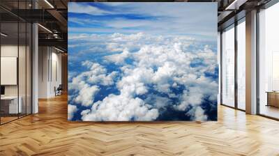 Aerial view of peaceful earth covered in clouds Wall mural