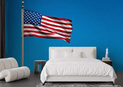 US American flag waving in the wind with beautiful blue sky in b Wall mural