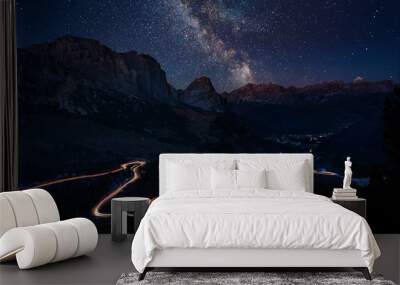 Traffic trails on mountain pass at night with milkyway Wall mural