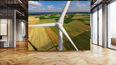 Wind turbine on a field, aerial photo Wall mural