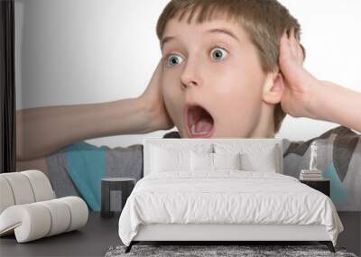 young little boy doing facial expressions Wall mural