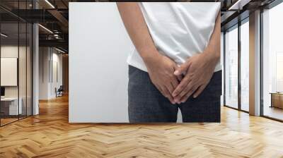 Hands covering the crotch of trousers (Gender Disease Concept) Wall mural