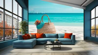 Wicker bag on the sandy beach with blue sea and sky background Wall mural