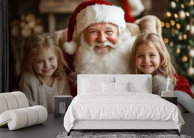 A santa with two little girls sitting on his lap Wall mural