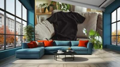 Black Shirt on White Couch Offers Casual Elegance in Home Interior Wall mural