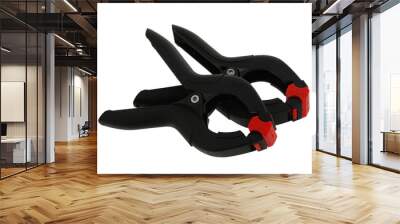 pair of black plastic clamps Wall mural