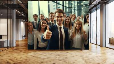 Creative team of young people showing thumbs up Wall mural