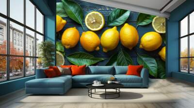 Fresh lemons on blue wooden background Wall mural