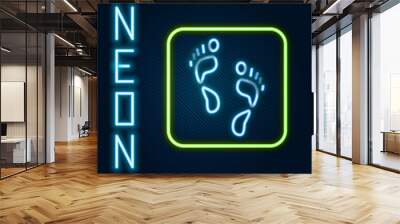 Glowing neon line Human footprint icon isolated on black background. Trace of human foot. Colorful outline concept. Vector Wall mural