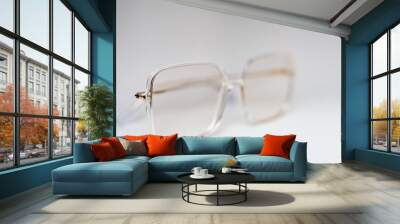 Isolated fashionable modern eyeglasses on white background. Eyesight stylish glasses. Stock photo Wall mural