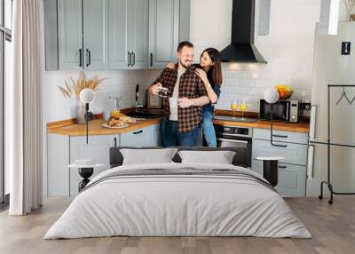 Casual couple in the kitchen at breakfast Wall mural