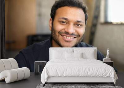 Cheerful and serene hindu man in smart casual shirt, headshot of young handsome indian guy, handsome mixed-race male looks at the camera with toothy smile Wall mural