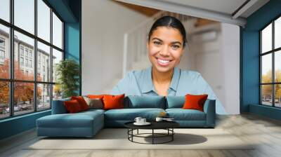 close-up portrait of happy young woman looking at the camera and smiling. concept of video call, onl Wall mural