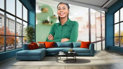 Portrait of confident African-American businesswoman standing with arms crossed, purposeful multiracial female office employee in smart casual wear looking at the camera and smiles Wall mural