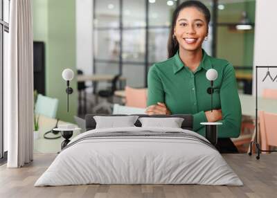 Successful young african-american female entrepreneur, small business owner, female office employee, black businesswoman wearing green casual shirt stands in confident pose with arms crossed Wall mural