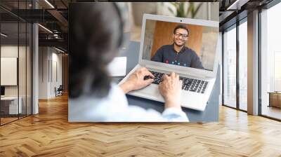 Two indian colleagues or friends speaking through the screen, using laptop app for virtual connect, video meeting, talking about joint startup, discussing details, develop concept and strategy Wall mural