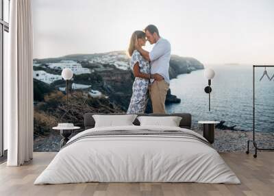 young couple hugging with Santorini view Wall mural