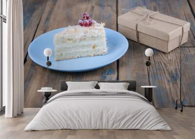 Delicious of piece cake on plate on wood table Wall mural