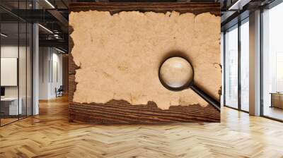 magnifying glass on old paper Wall mural