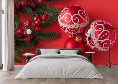 many red christmas balls on red background with copy space. New Year greeting card. Wall mural