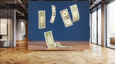 Set of flying 1 dollars banknotes against blue wall background Wall mural