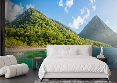 Caribbean beach with palms and straw umrellas on the shore with Gros Piton mountain in the background, Sugar beach, Saint  Lucia Wall mural