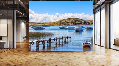 Motor boats anchored at the coast of Titicaca lake, Bolivia Wall mural