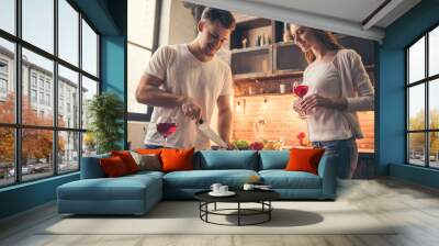 Beautiful couple cooking Wall mural