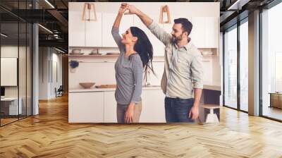 Beautiful couple in kitchen Wall mural