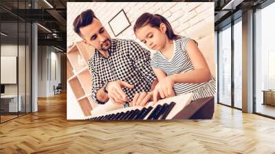 Father and Doudhter Play Piano and in Apartment. Wall mural