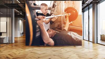 Father and son in the gym. Father and son spend time together and lead a healthy lifestyle. Wall mural