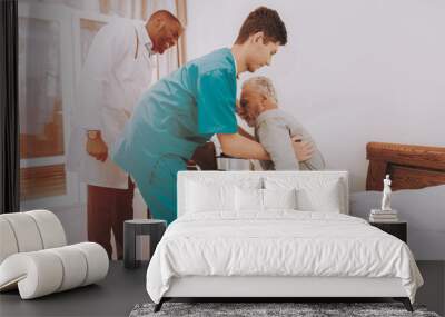 Get Out of Bed. Nurse Helps. Elderly Man. Patient. Wall mural