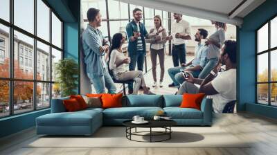 group of young business people taking break in office Wall mural