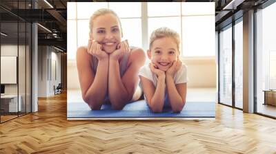 Mother and daughter doing sport Wall mural