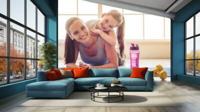 Mother and daughter doing sport Wall mural