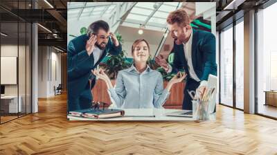 People shout at meditating worker in office. Wall mural