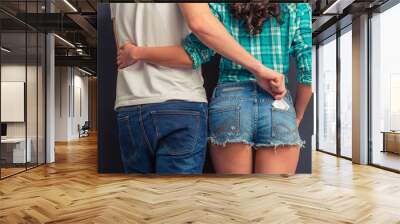 Young couple with condom Wall mural