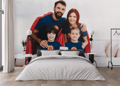 Young Family In Superhero Suits. Dinner Concept. Wall mural